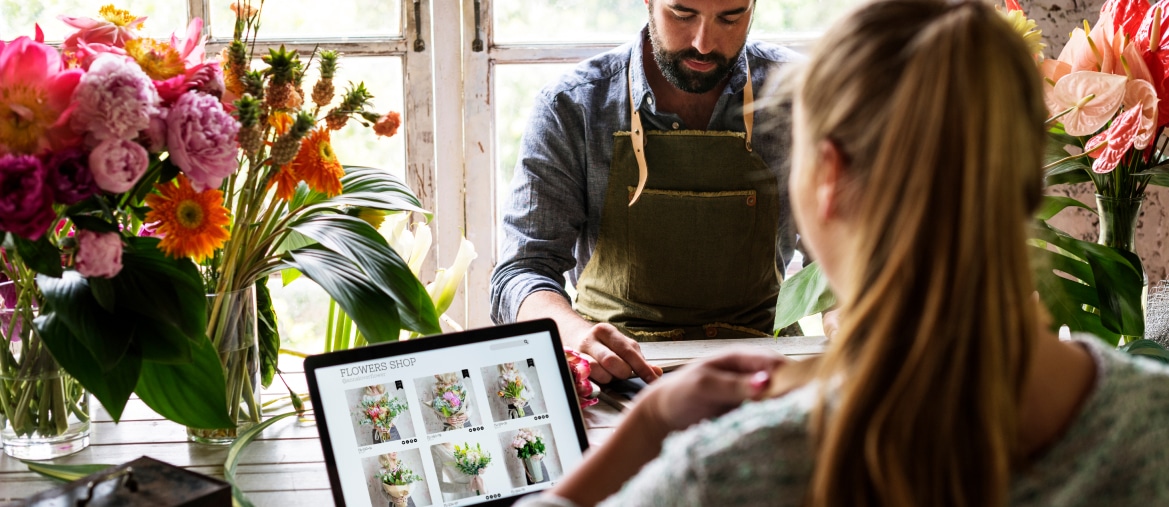 woman browsing a flower shop online store on an ipad